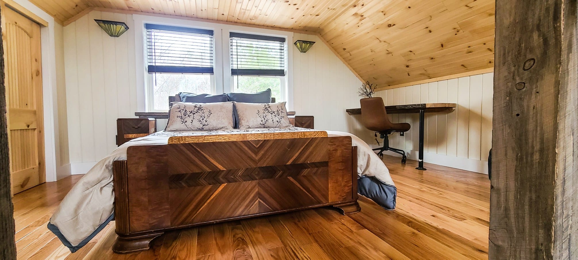 Comfortable bed with natural design elements in the Cliff House