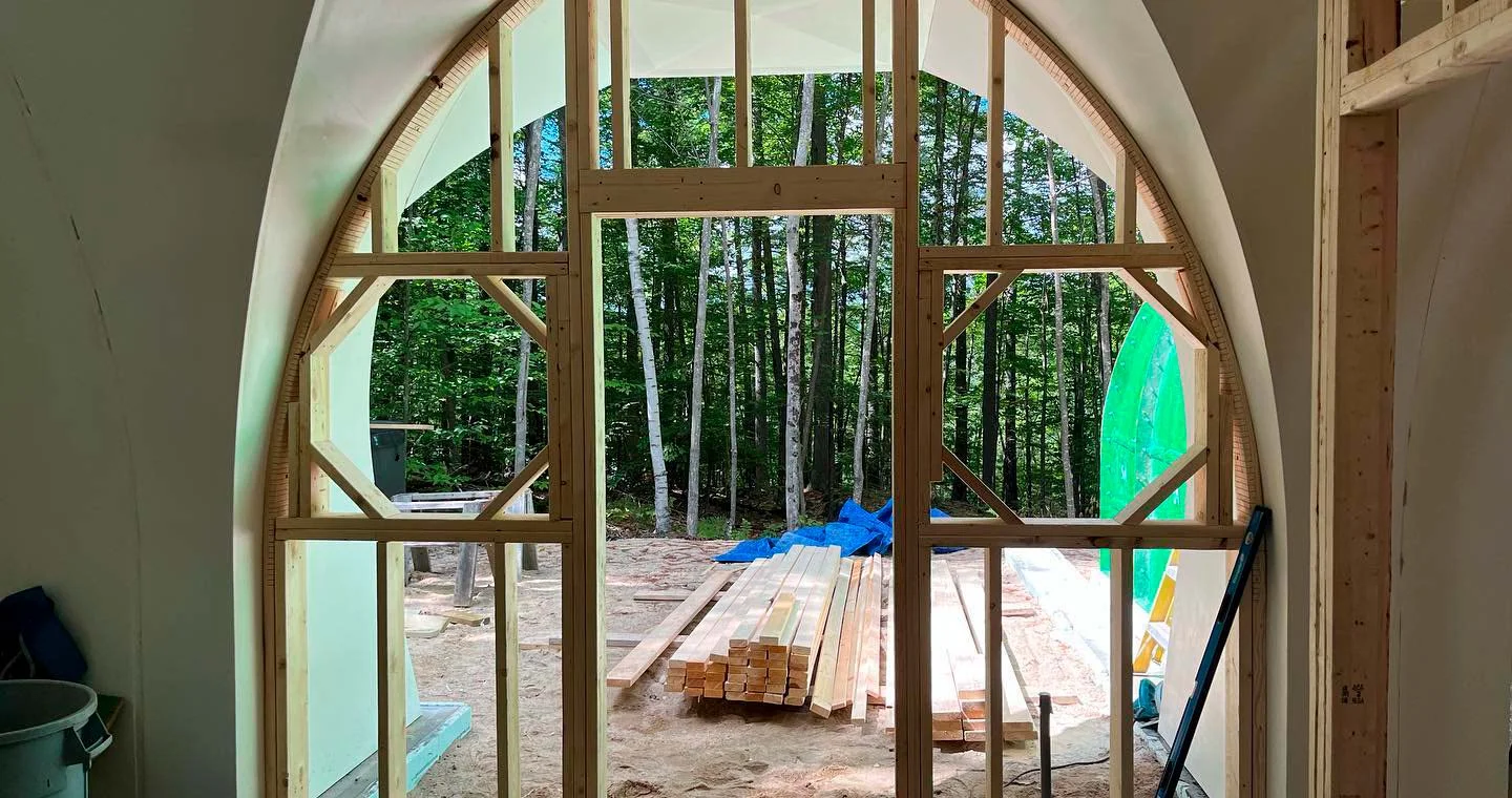 Interior wood framing fitted inside The Shire’s curved structural shell.