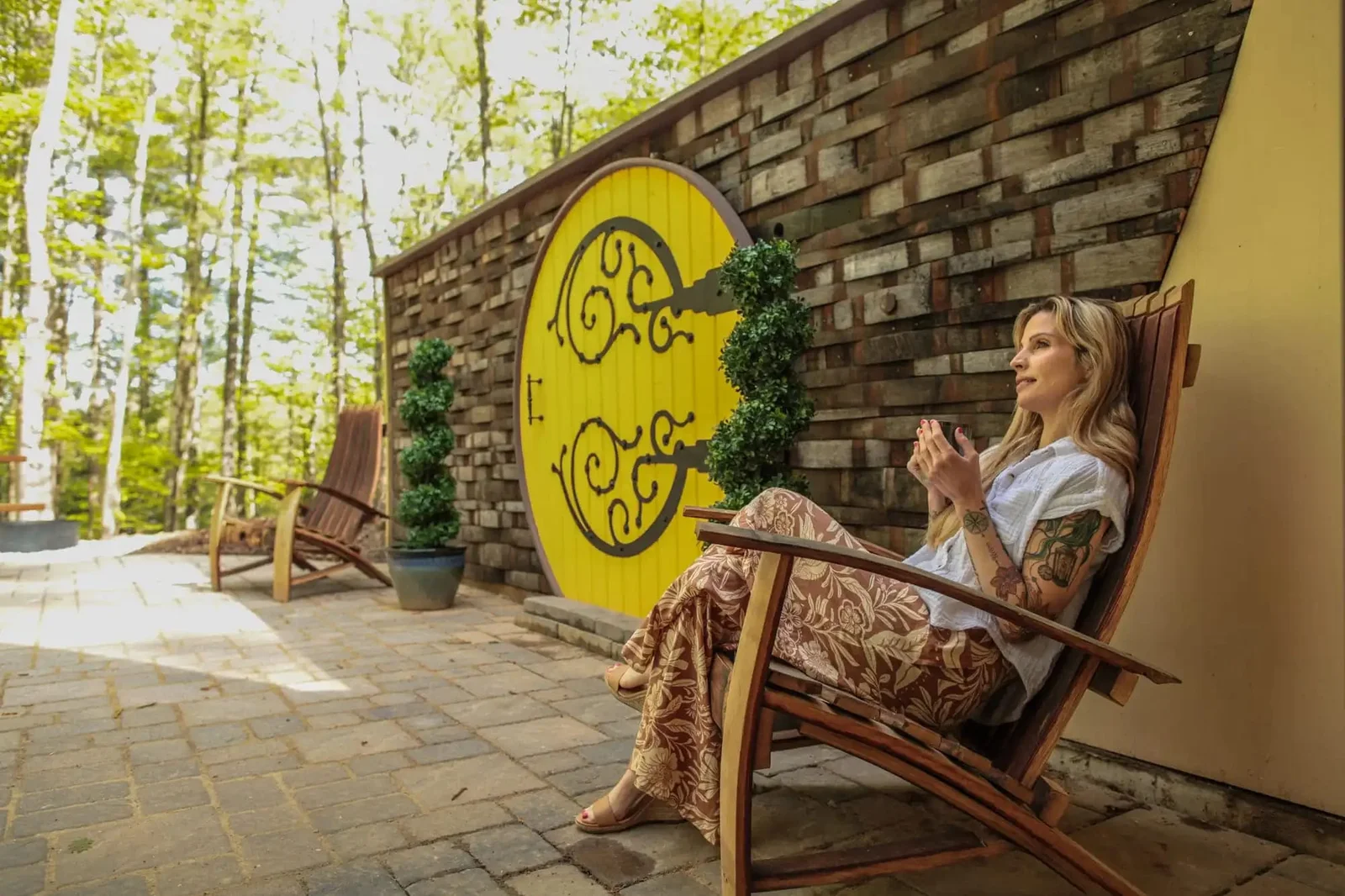 Outdoor living area at The Shire with a hot tub and private lake access.